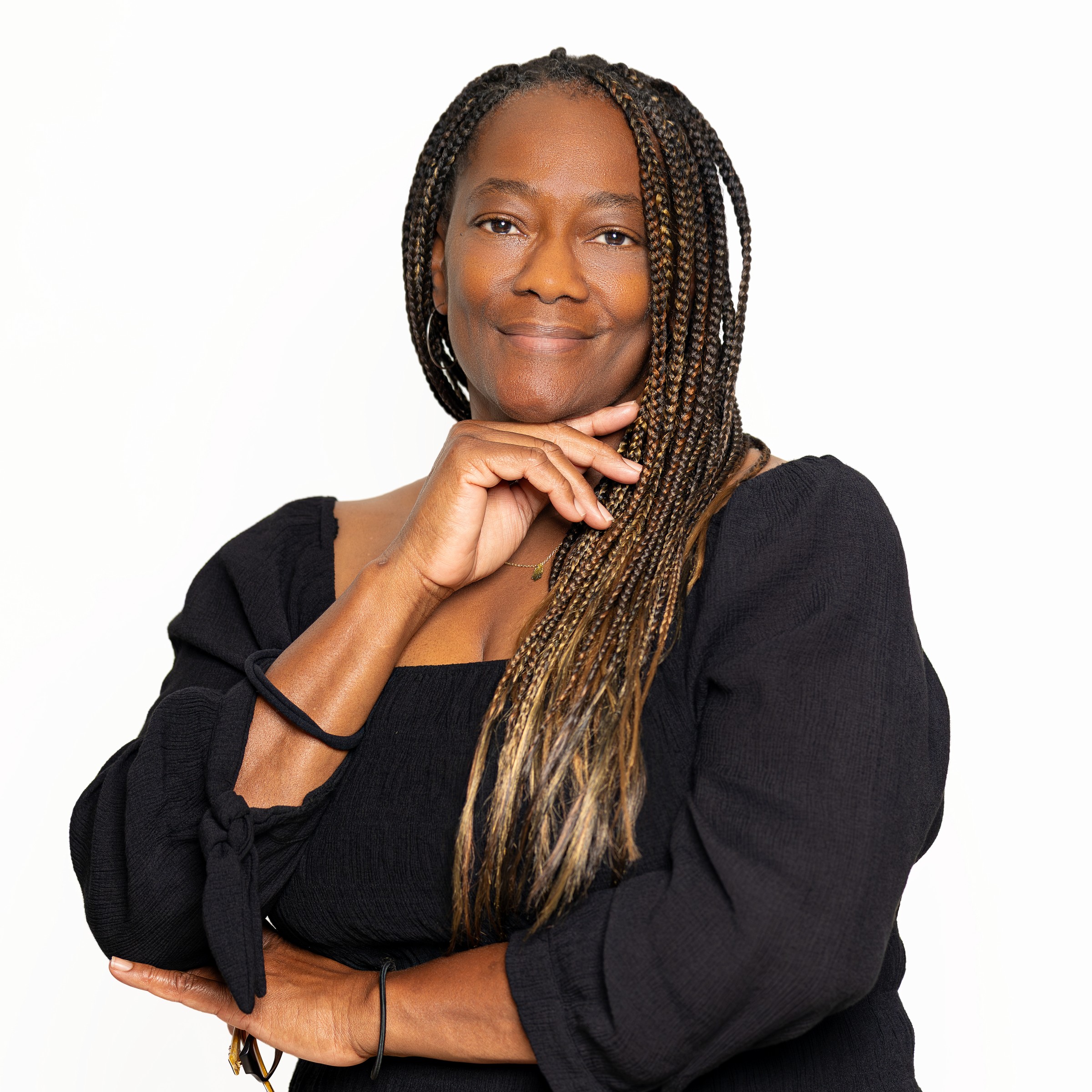 Black professional photographed with accurate skin tone and confident expression