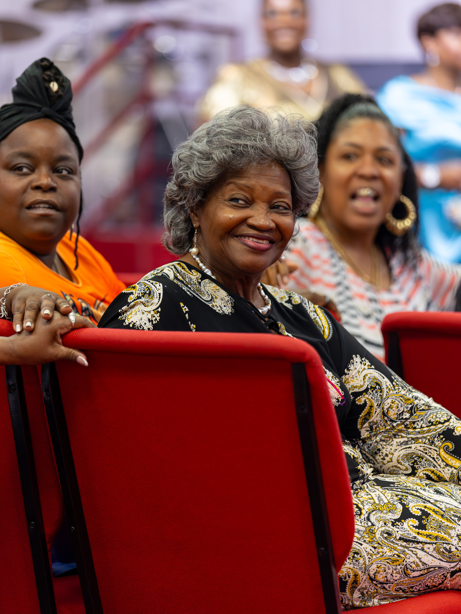 Older guest smiling during a meaningful church celebration