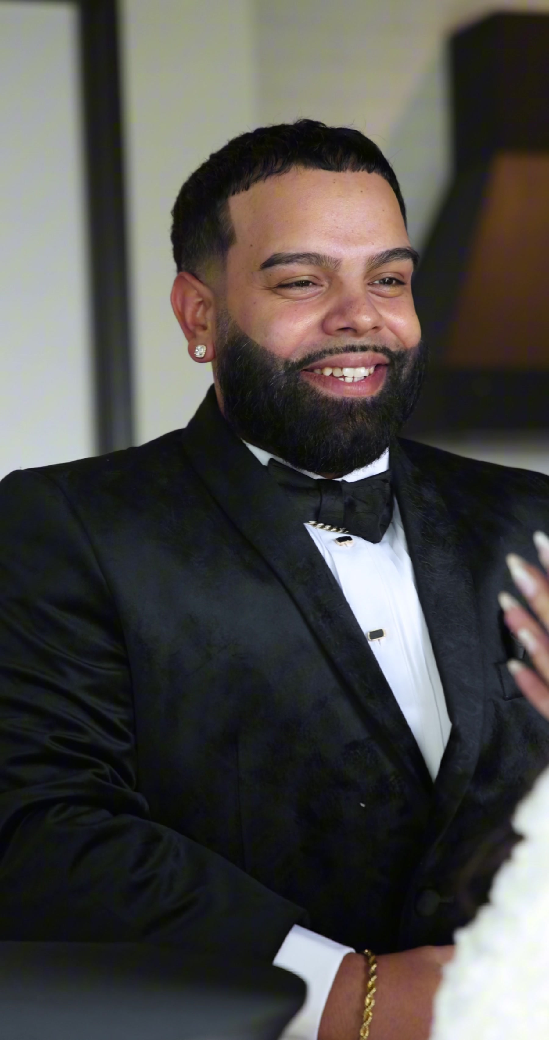 Black male professional in formal attire photographed with warmth and confidence