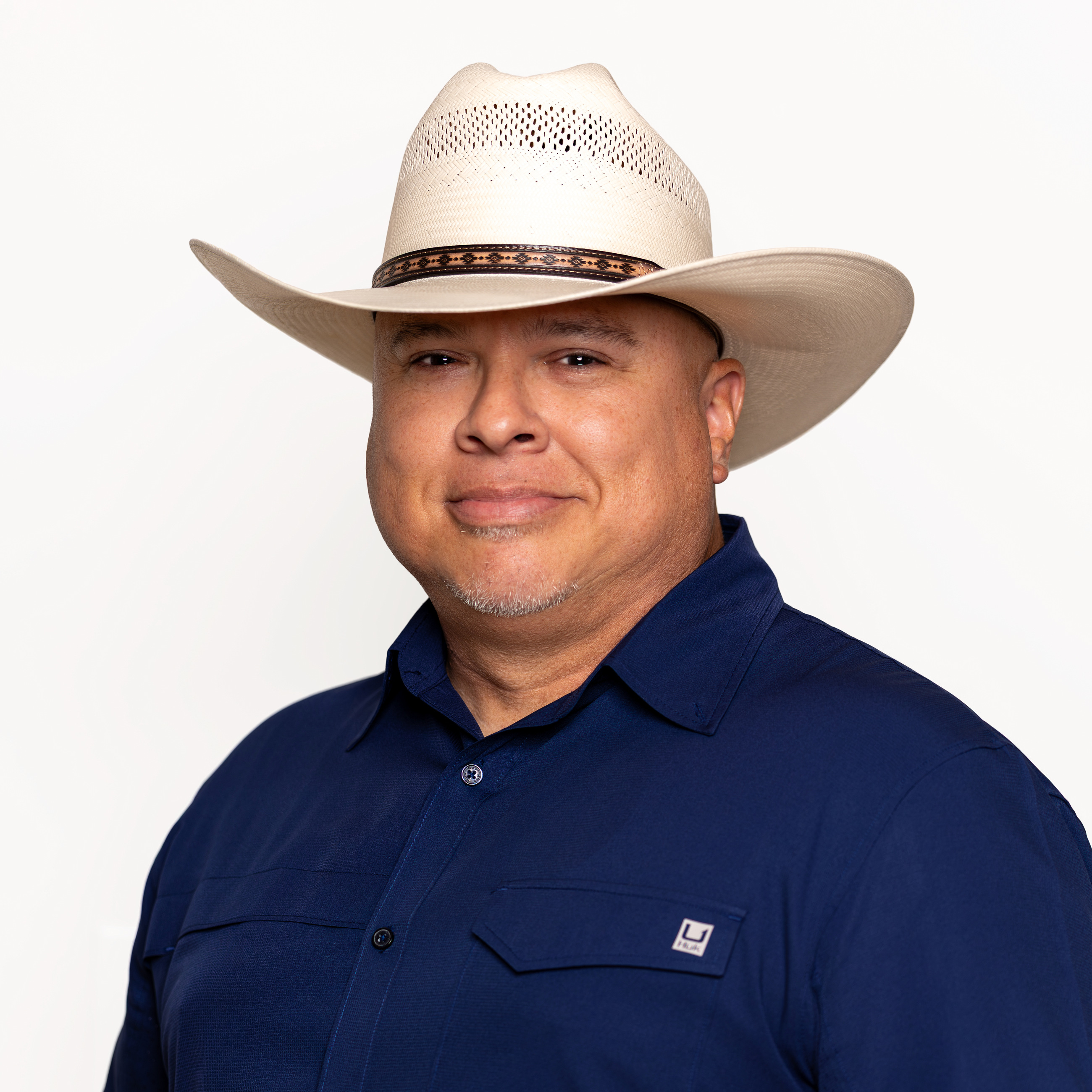 Hispanic male professional photographed in a clean studio portrait