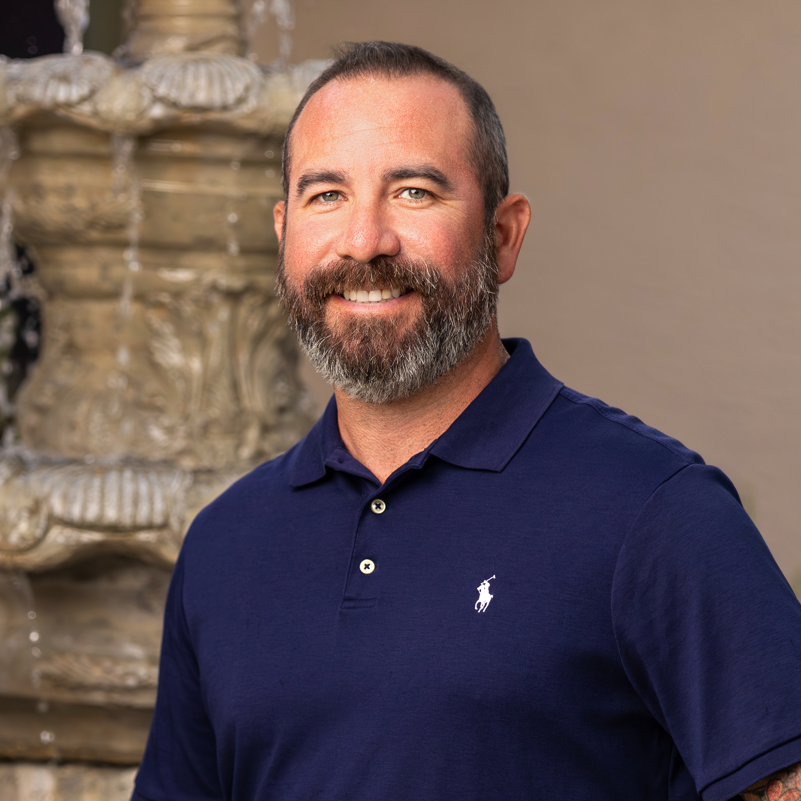 White male business professional photographed outdoors with a confident natural expression