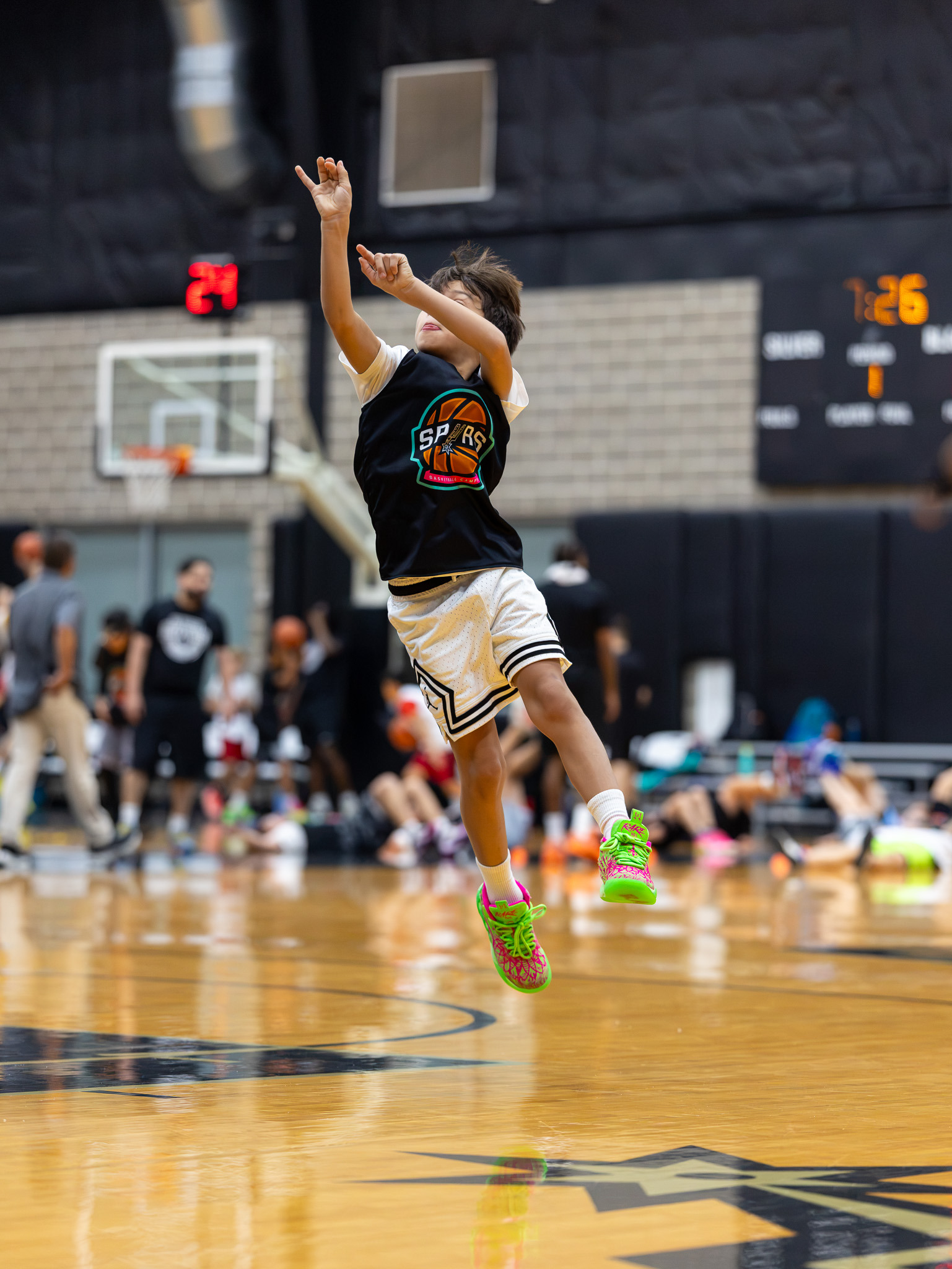 Young basketball player attacking the basket during camp